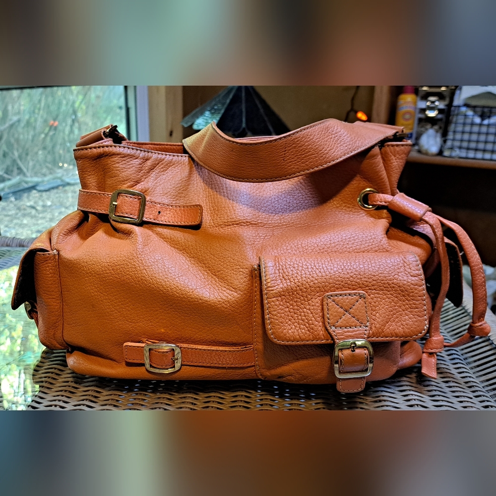 Maxx New York Pebbled Orange Leather Shoulder Bag.